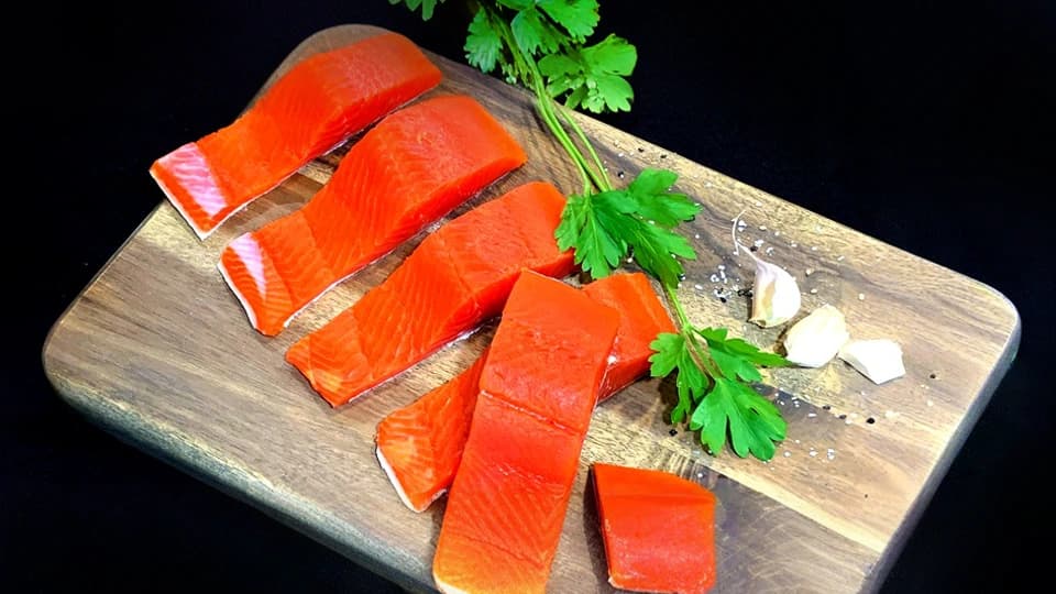 Fresh wild Alaskan salmon on a fishing net